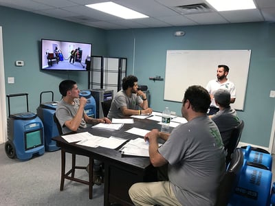 Evan MacFawn training restoration technicians.