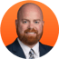 chris-elliott-headshot-orange